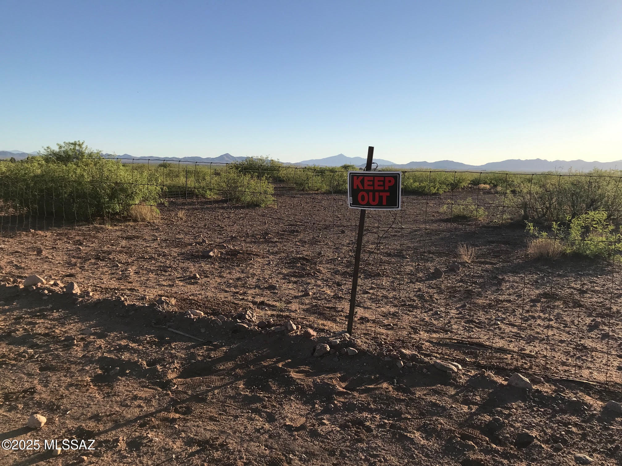 5962 North Haas Road Douglas, AZ 85607 - Photo 5 of 6 a view of a dry yard with wooden fence