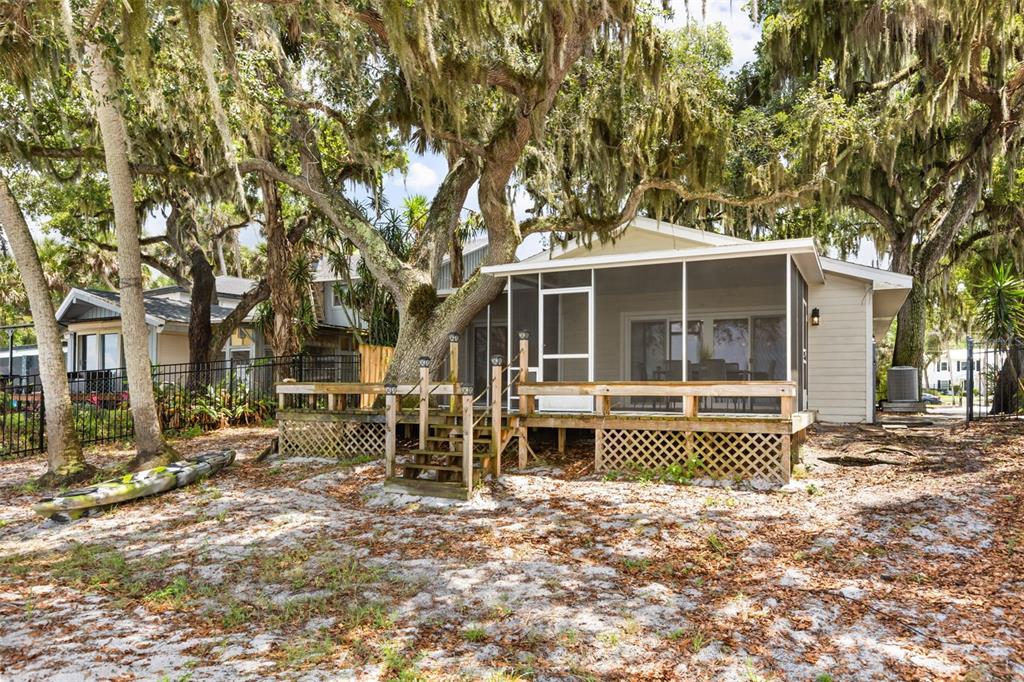2462 Fort Lane Road Geneva, FL 32732 - Photo 23 of 31 a front view of a house with a garden