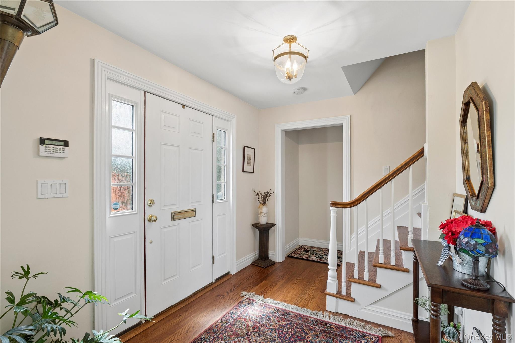 50 Belton Road Babylon, NY 11702 - Photo 8 of 34 Light and bright spacious entry leads to kitchen, living room and 1st floor master bedroom suite.
