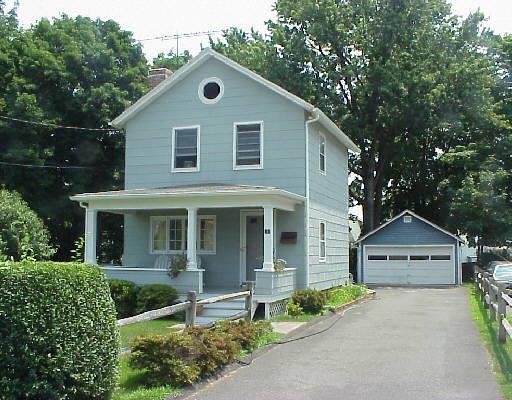 3 Warren Street Norwalk, CT 06851 - Photo 1 of 1 a front view of a house with garden