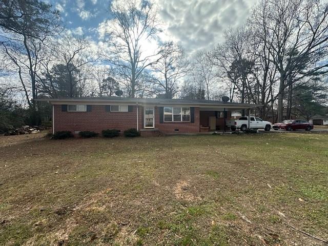 175 Ridgecrest Drive Northwest Calhoun, GA 30701 - Photo 2 of 17 a view of a house with a garden and sitting area