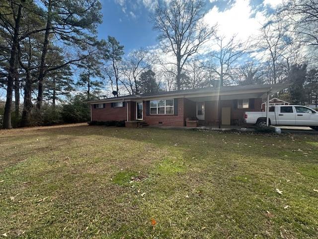 175 Ridgecrest Drive Northwest Calhoun, GA 30701 - Photo 5 of 17 a view of a house with a yard and sitting area