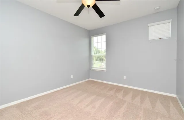a view of a house with a yard and plants
