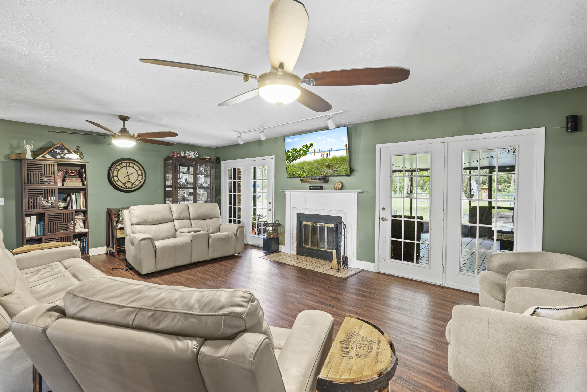 4170 McCarty Road Fort Pierce, FL 34945 - Photo 17 of 57 a living room with furniture and a fireplace