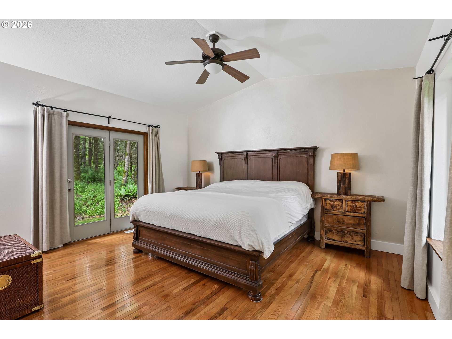 873 Mountain View Road Kalama, WA 98625 - Photo 23 of 45 a bedroom with a bed and a large window