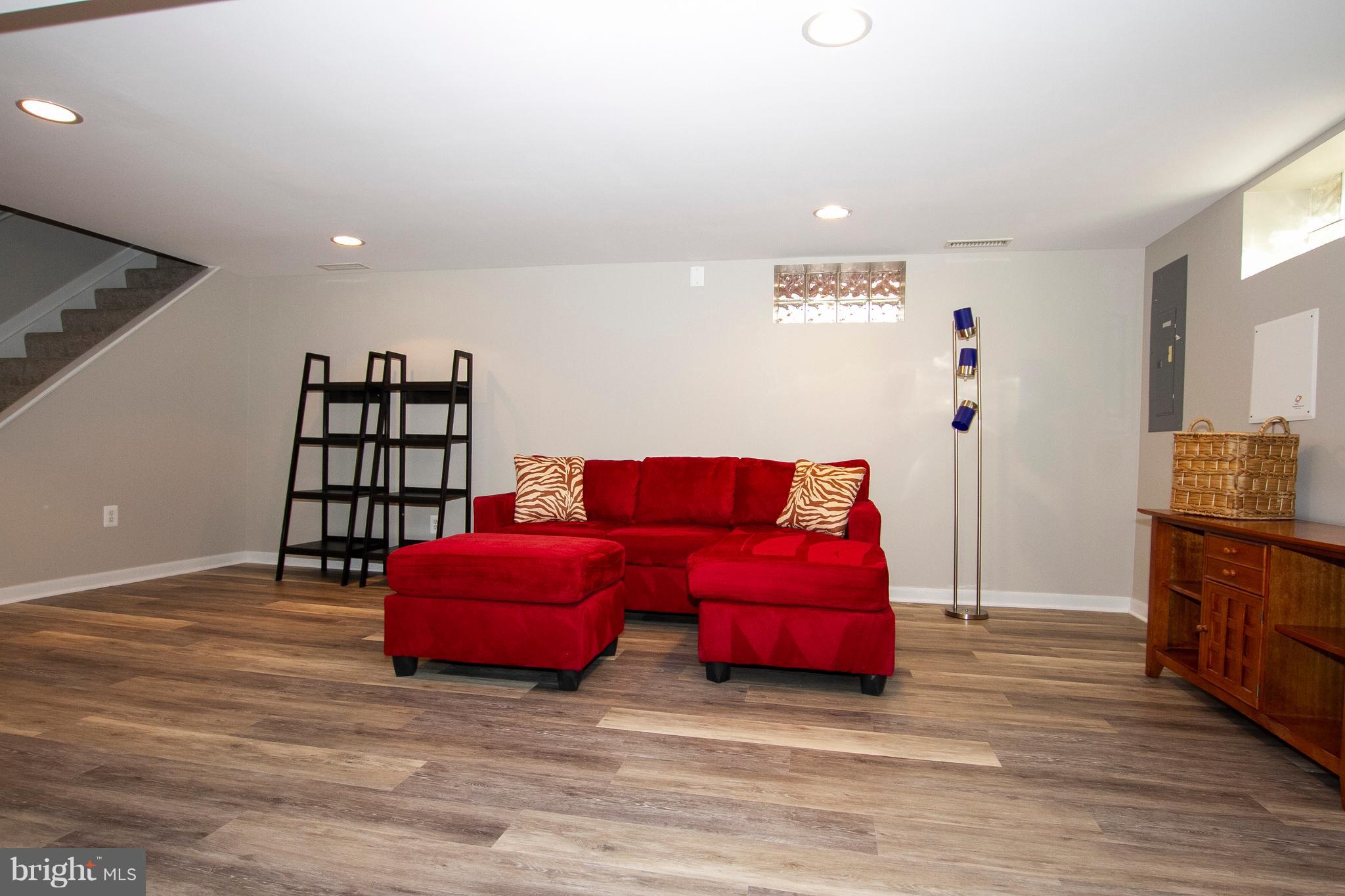 1904 Logwind Road Catonsville, MD 21228 - Photo 22 of 34 a room with furniture and wooden floor