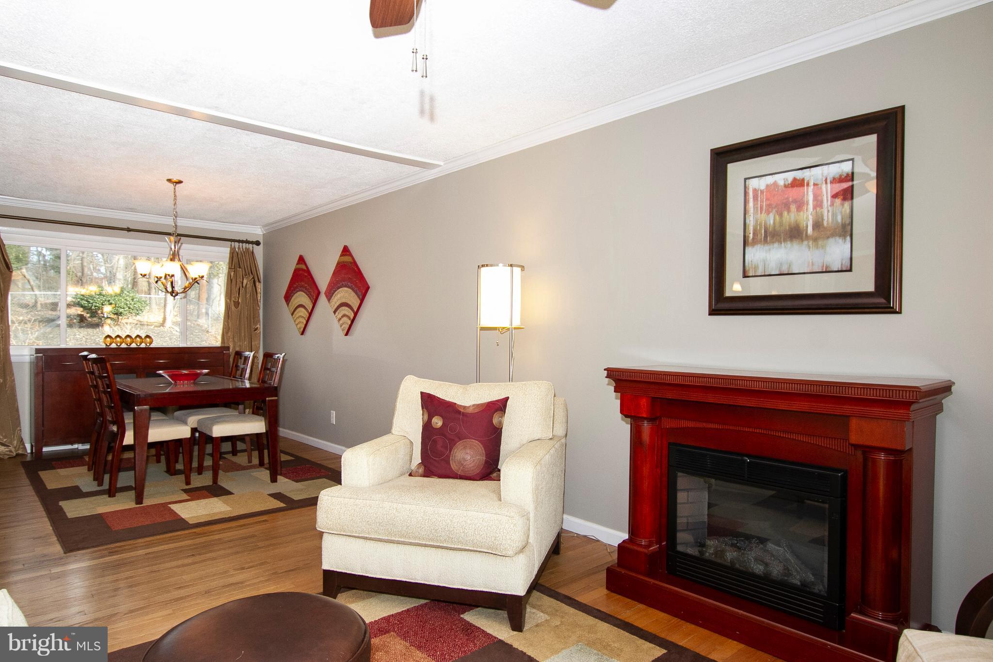1904 Logwind Road Catonsville, MD 21228 - Photo 4 of 34 a living room with furniture and a fireplace