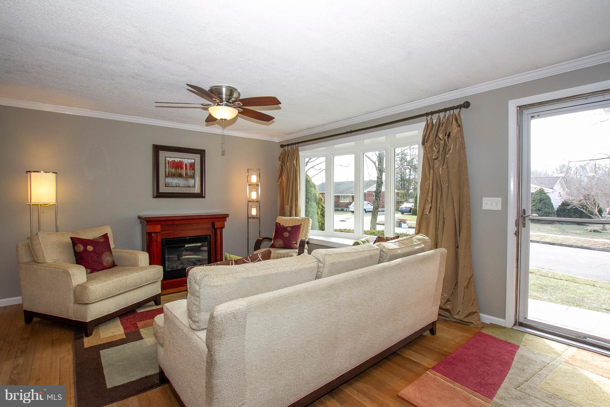1904 Logwind Road Catonsville, MD 21228 - Photo 5 of 34 a living room with furniture and a fireplace