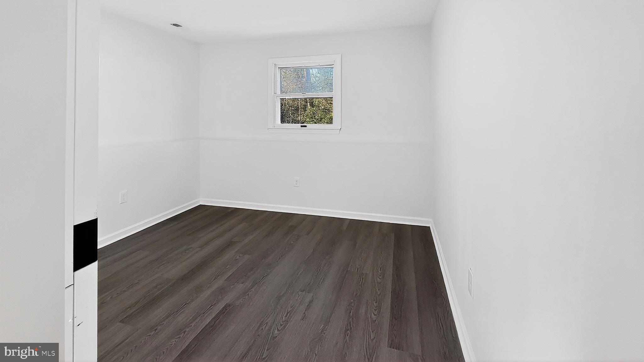 232 Morris Drive Salisbury, MD 21804 - Photo 25 of 36 a view of an empty room with wooden floor