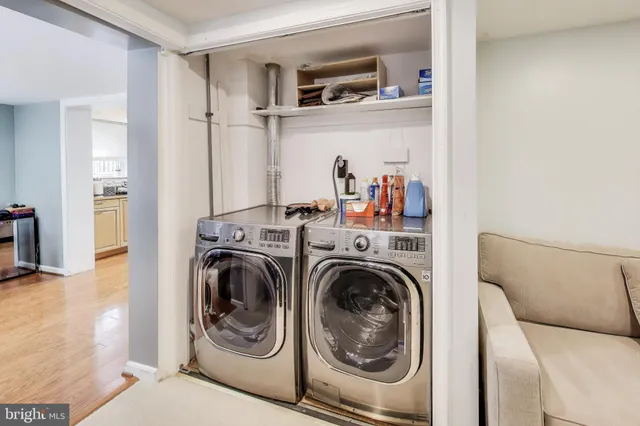 a view of a house with backyard sitting area and garden