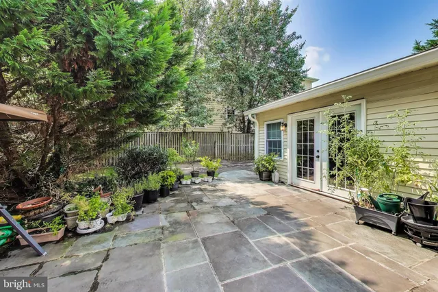 a view of a house with a yard and a garage