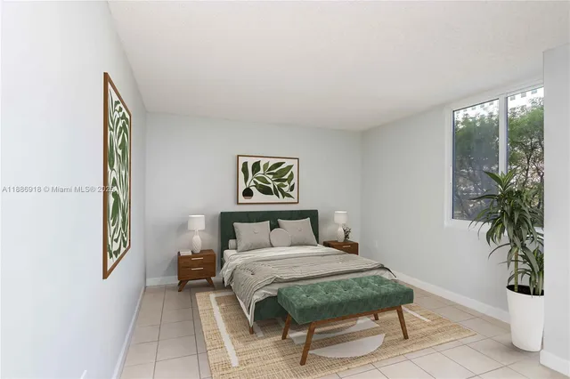 a bedroom with a bed and a potted plant next to a window