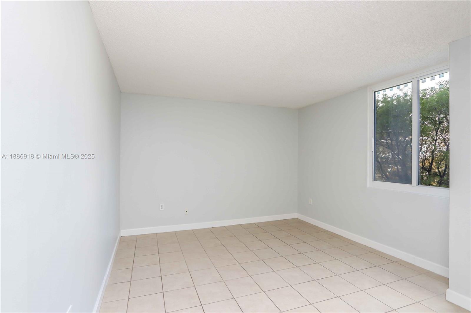 850 North Miami Avenue, Unit W305 Miami, FL 33136 - Photo 16 of 27 a view of an empty room and window