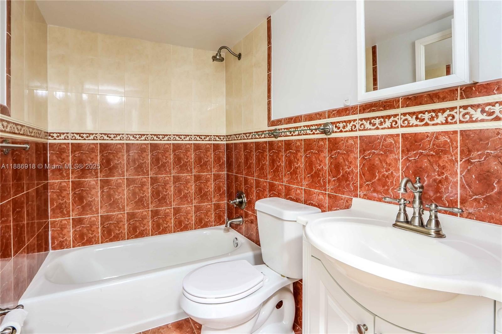 850 North Miami Avenue, Unit W305 Miami, FL 33136 - Photo 18 of 27 a bathroom with a sink a toilet and a bathtub