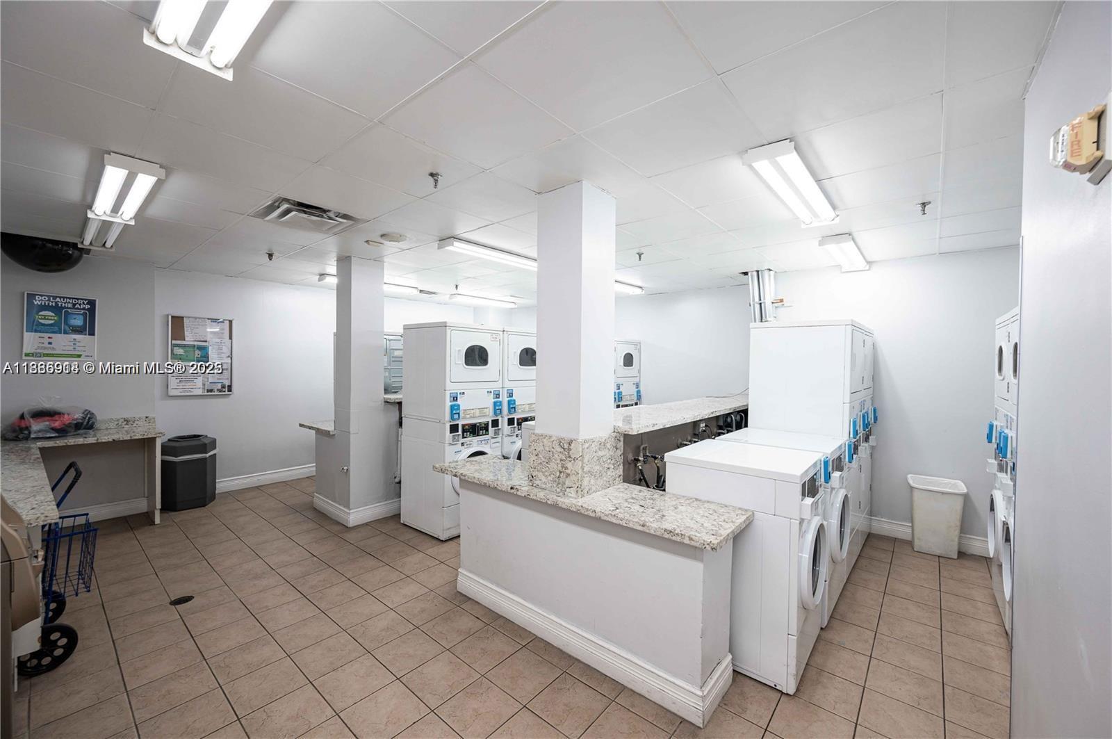 850 North Miami Avenue, Unit W305 Miami, FL 33136 - Photo 20 of 27 a bathroom with a sink a toilet and a large mirror