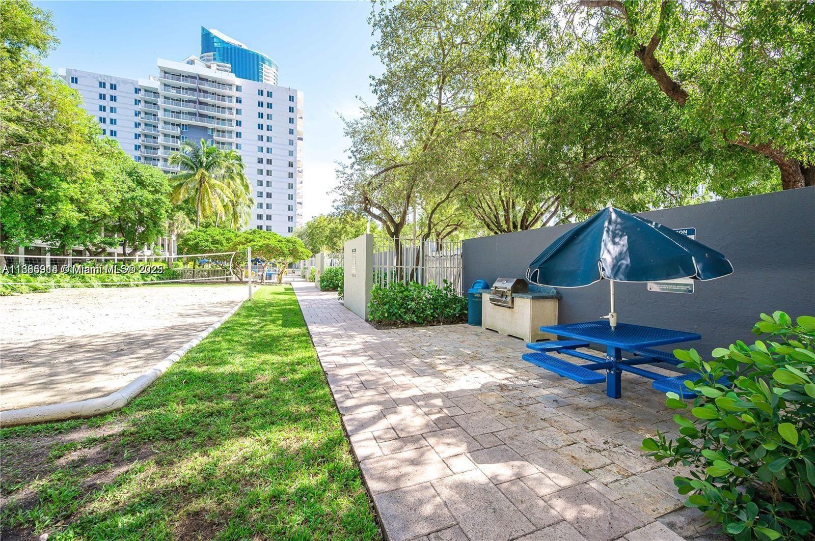 850 North Miami Avenue, Unit W305 Miami, FL 33136 - Photo 23 of 27 a backyard of a house with outdoor seating