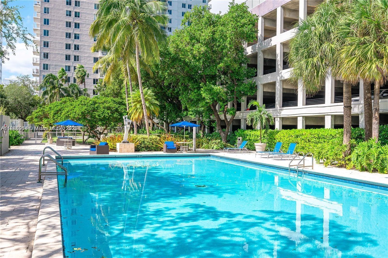 850 North Miami Avenue, Unit W305 Miami, FL 33136 - Photo 25 of 27 a view of a swimming pool with a garden