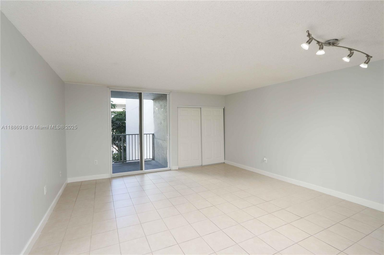 850 North Miami Avenue, Unit W305 Miami, FL 33136 - Photo 4 of 27 wooden floor in an empty room with a window