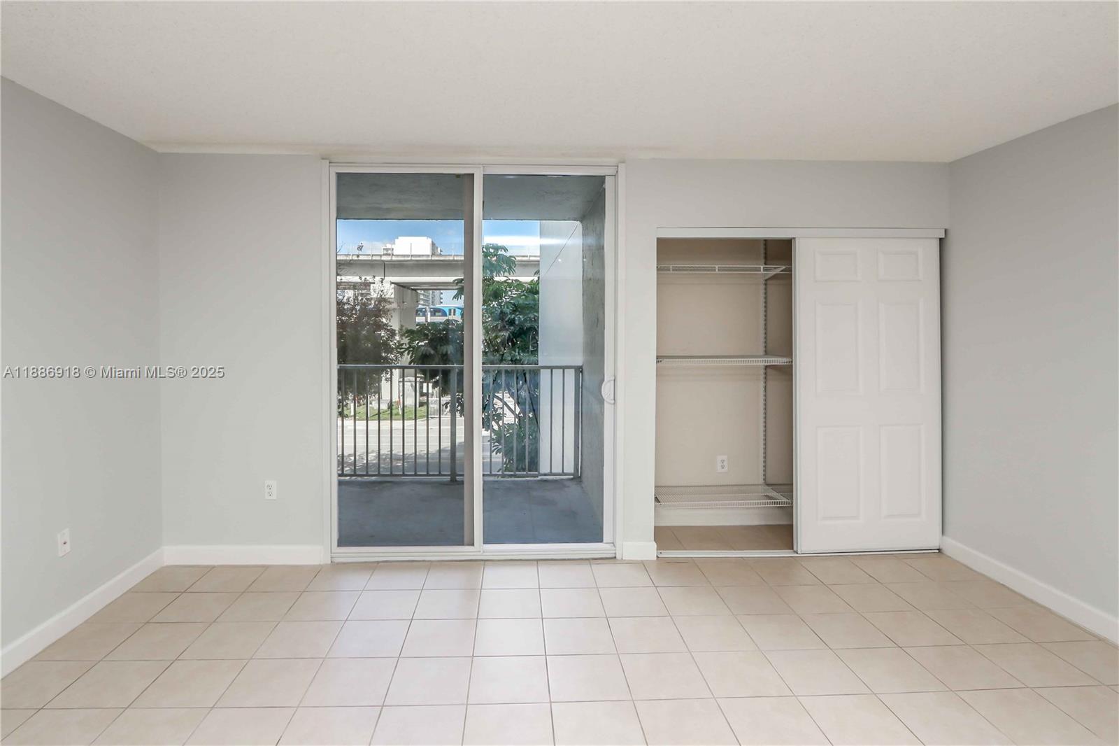 850 North Miami Avenue, Unit W305 Miami, FL 33136 - Photo 6 of 27 a view of an empty room with glass door