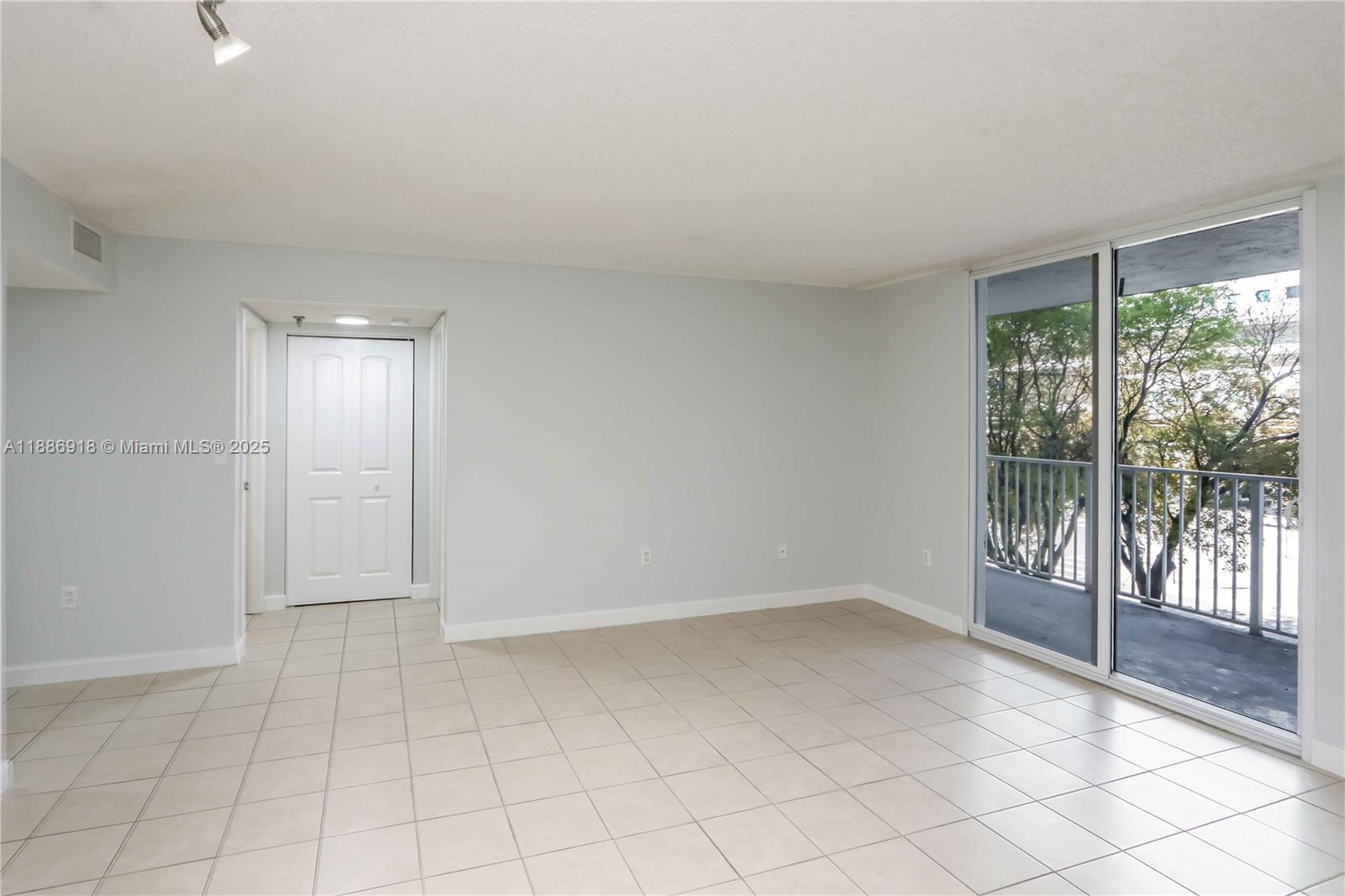 850 North Miami Avenue, Unit W305 Miami, FL 33136 - Photo 8 of 27 wooden floor in an empty room with a window