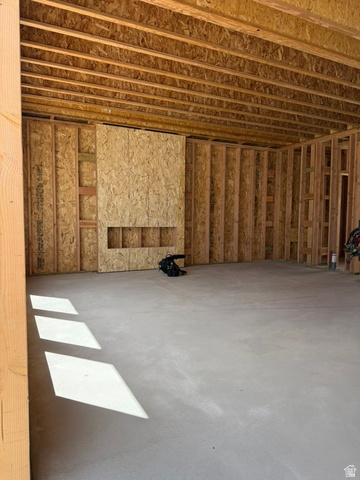 250 West 550 North Smithfield, UT 84335 - Photo 5 of 8 Unfinished interior space featuring exposed wood framing, an open ceiling with visible joists, and a concrete slab floor