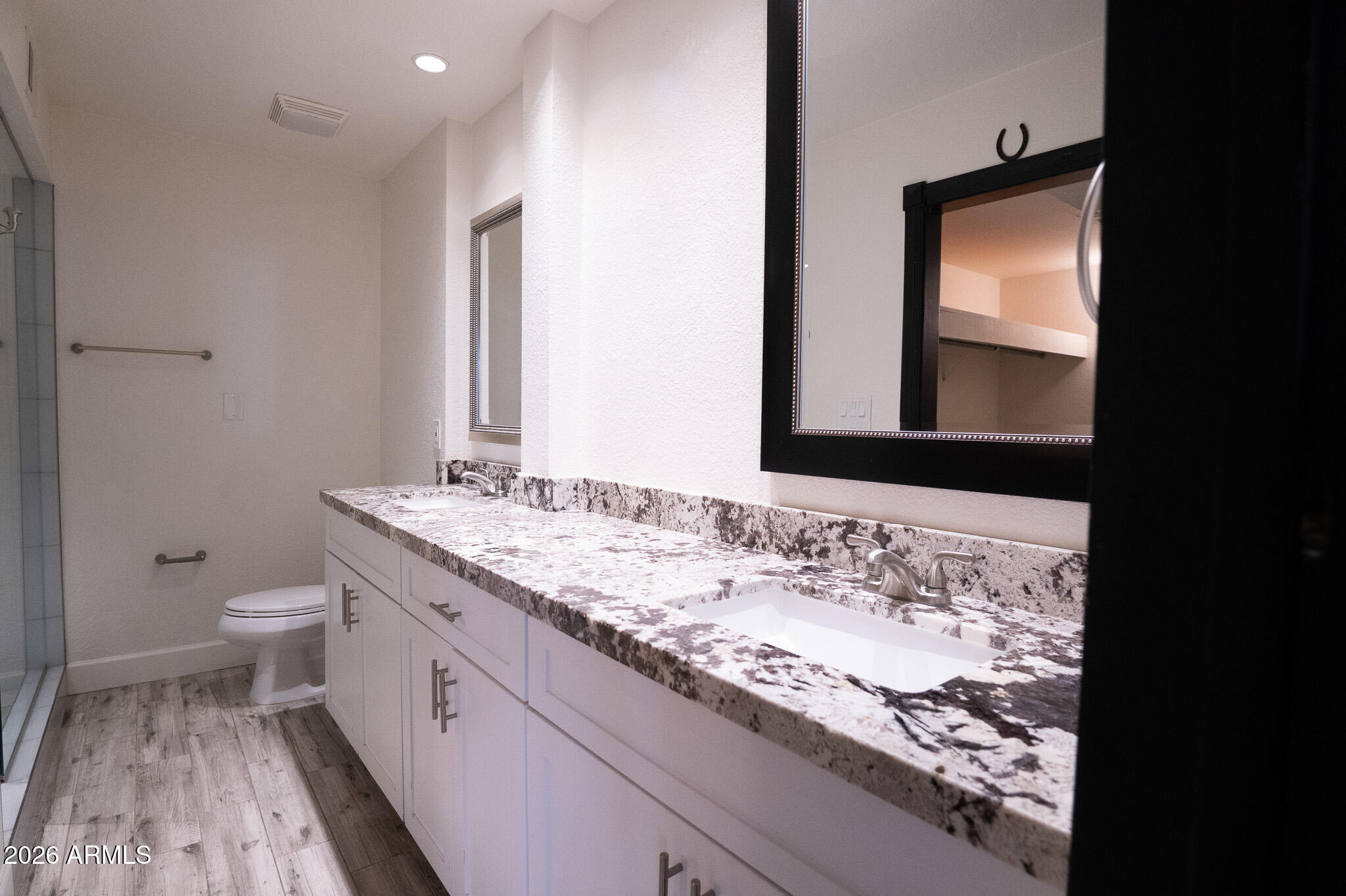 5100 North Miller Road, Unit 3 Scottsdale, AZ 85250 - Photo 24 of 31 a bathroom with a granite countertop sink and a toilet