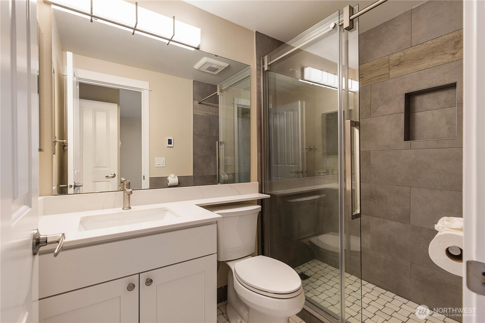 755 5th Avenue Northwest, Unit D202 Issaquah, WA 98027 - Photo 19 of 25 a bathroom with a sink toilet and shower