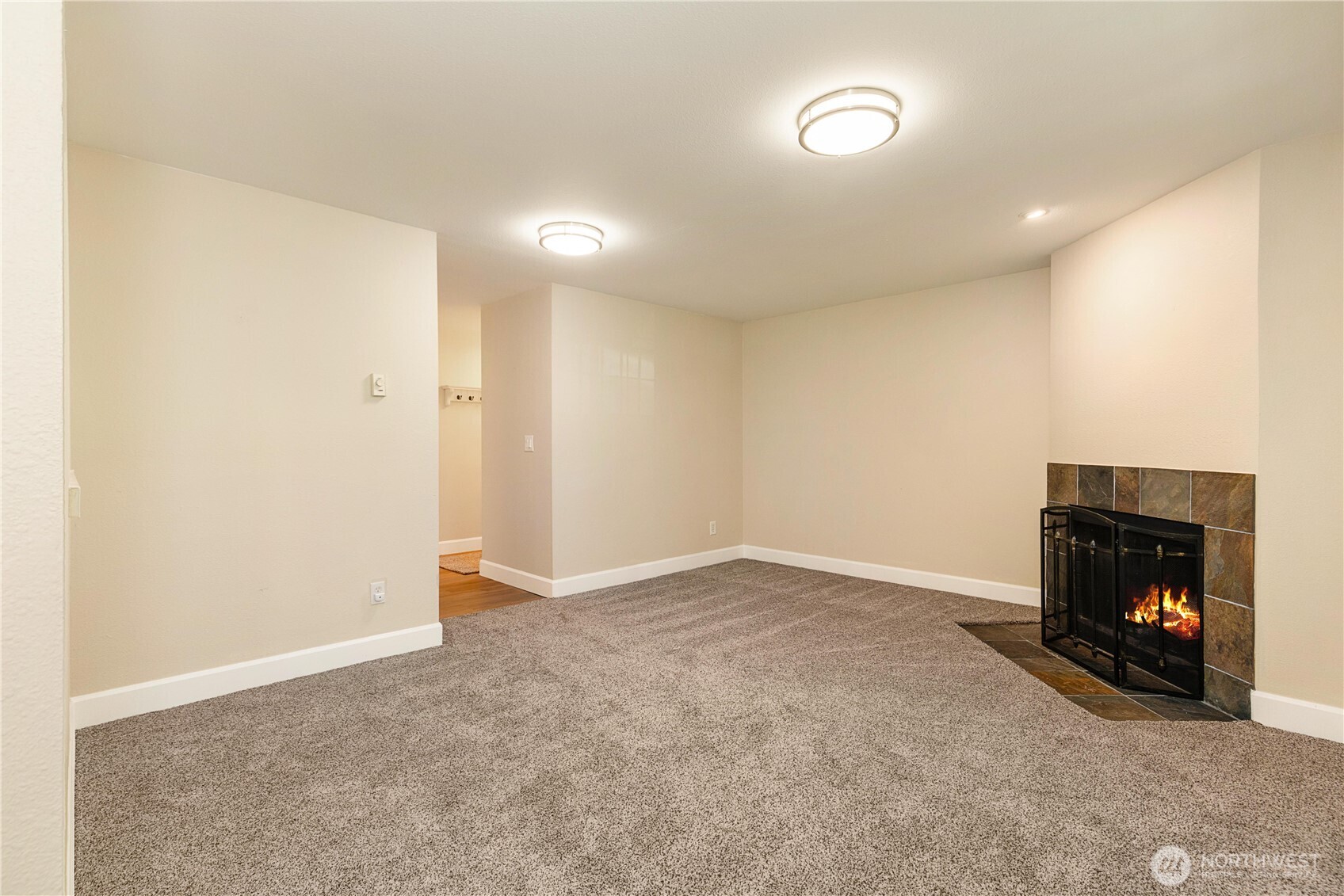 755 5th Avenue Northwest, Unit D202 Issaquah, WA 98027 - Photo 8 of 25 a view of an empty room with a fireplace