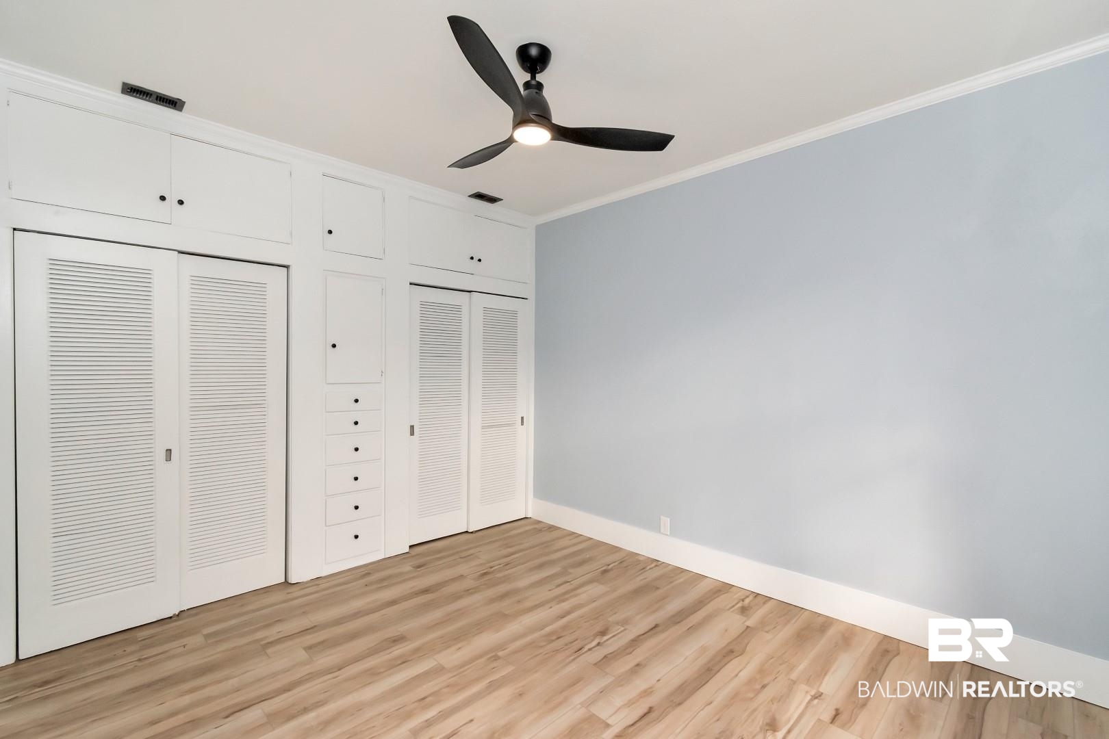 555 Michigan Avenue Mobile, AL 36604 - Photo 21 of 28 Unfurnished bedroom featuring ceiling fan, light hardwood / wood-style flooring, and crown molding