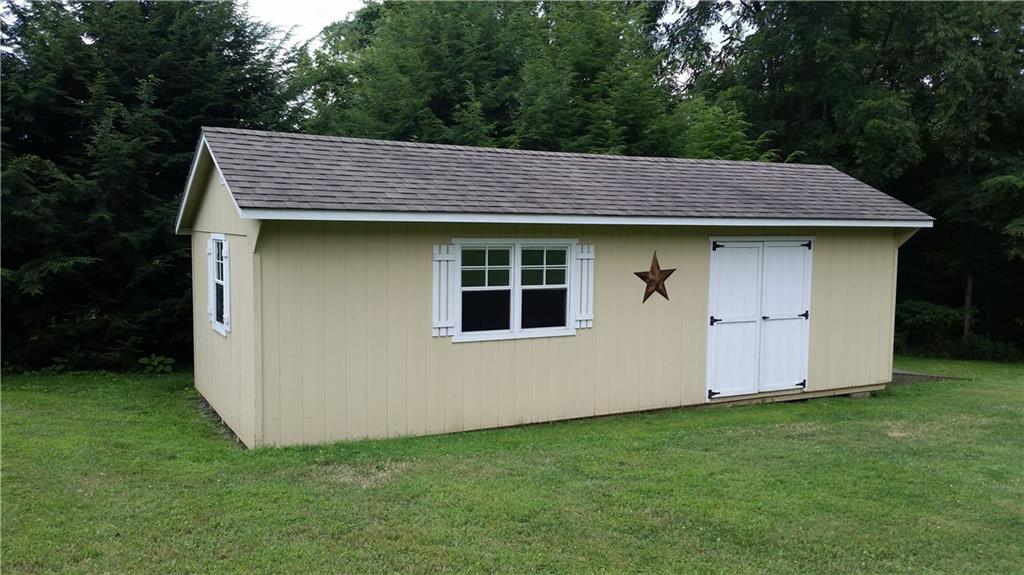 119 Fir Street Rillton, PA 15678 - Photo 13 of 16 Large work shed with side ramped tractor entrance