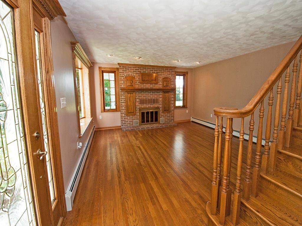 119 Fir Street Rillton, PA 15678 - Photo 6 of 16 Living room is equipped with recessed lighting, wood burning fireplace, and hard wood floors