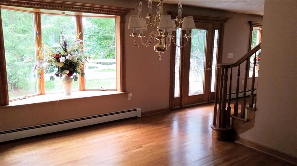 119 Fir Street Rillton, PA 15678 - Photo 7 of 16 Roomy dining room with a brass chandelier