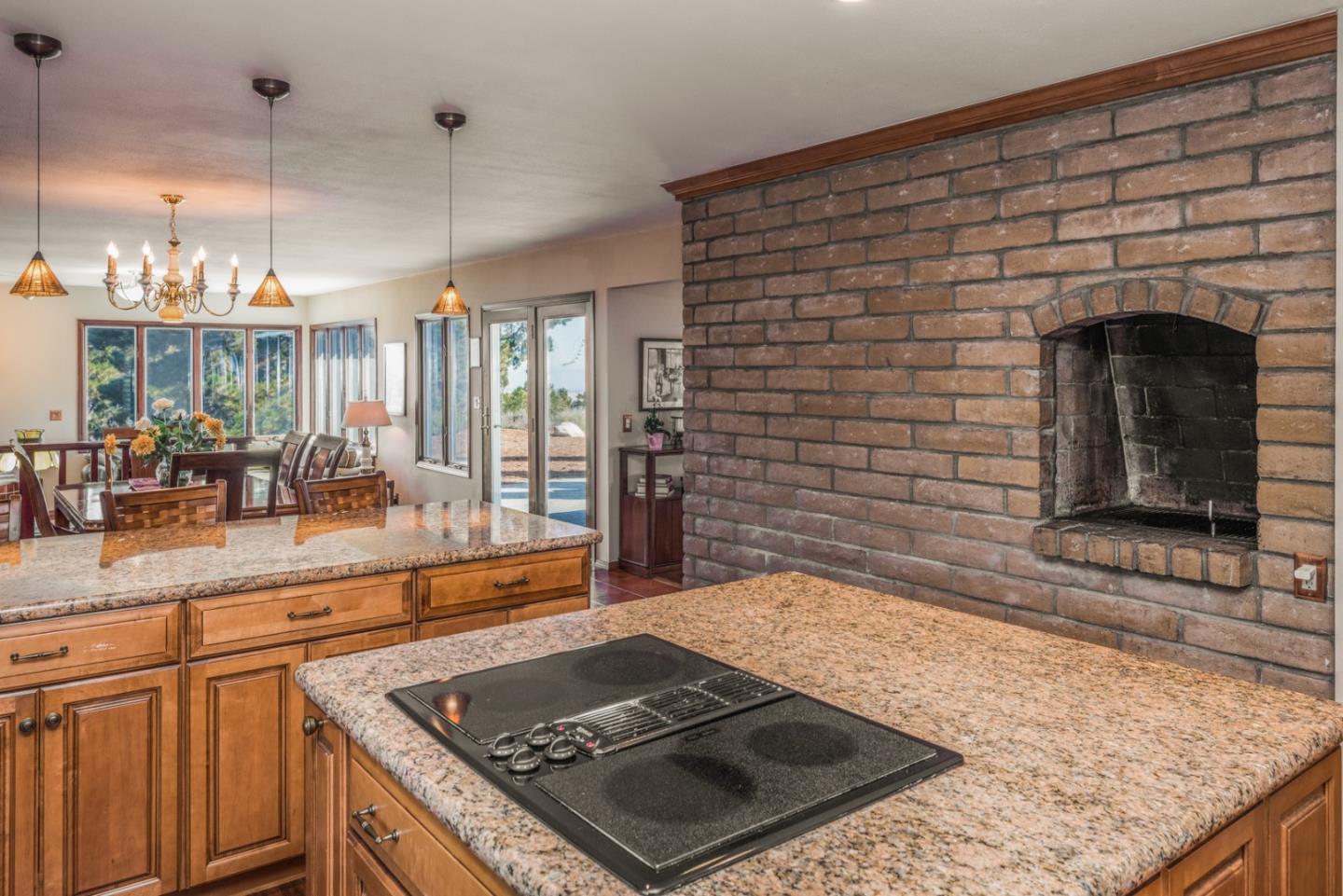 12765 Sundance Lane Carmel Valley, CA 93924 - Photo 12 of 43 a open kitchen view of a fireplace