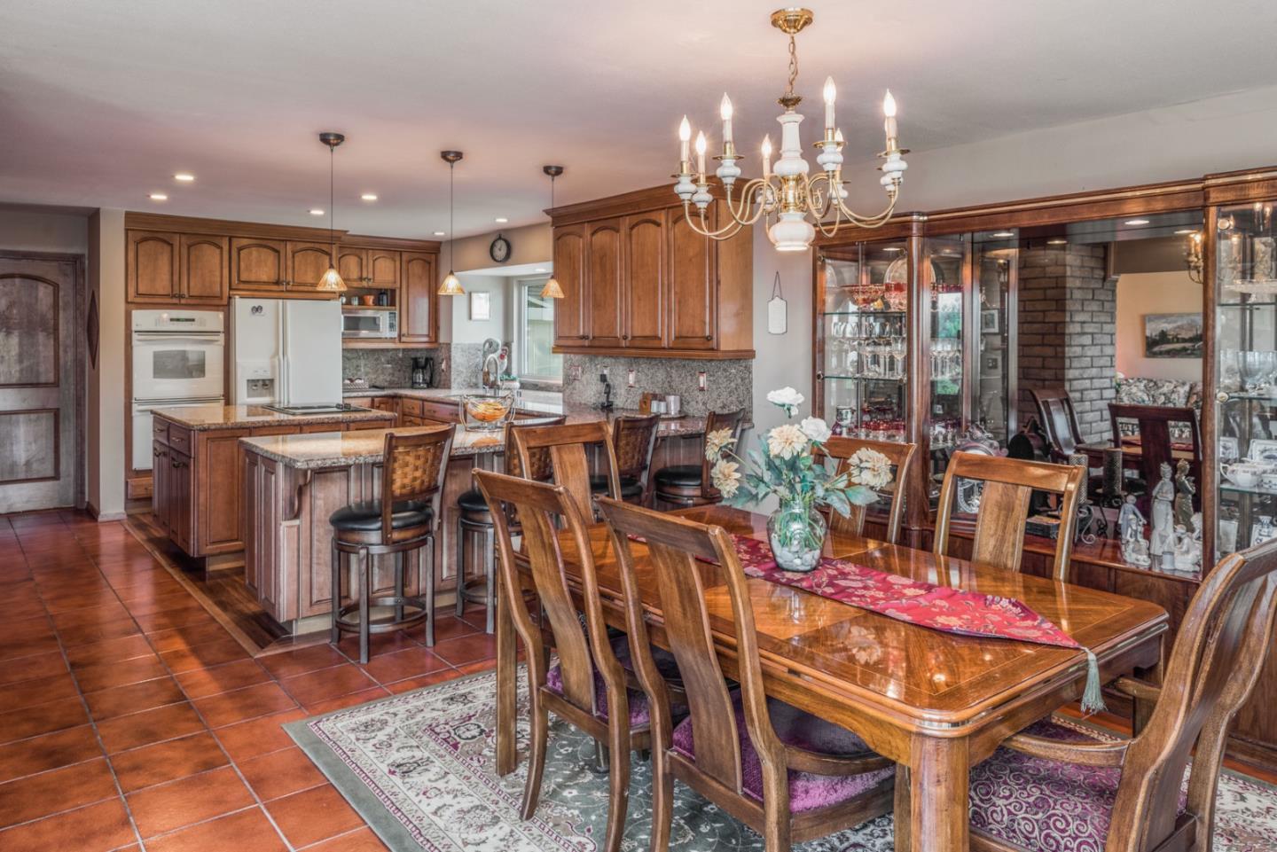 12765 Sundance Lane Carmel Valley, CA 93924 - Photo 14 of 43 a view of a dining room with furniture and chandelier
