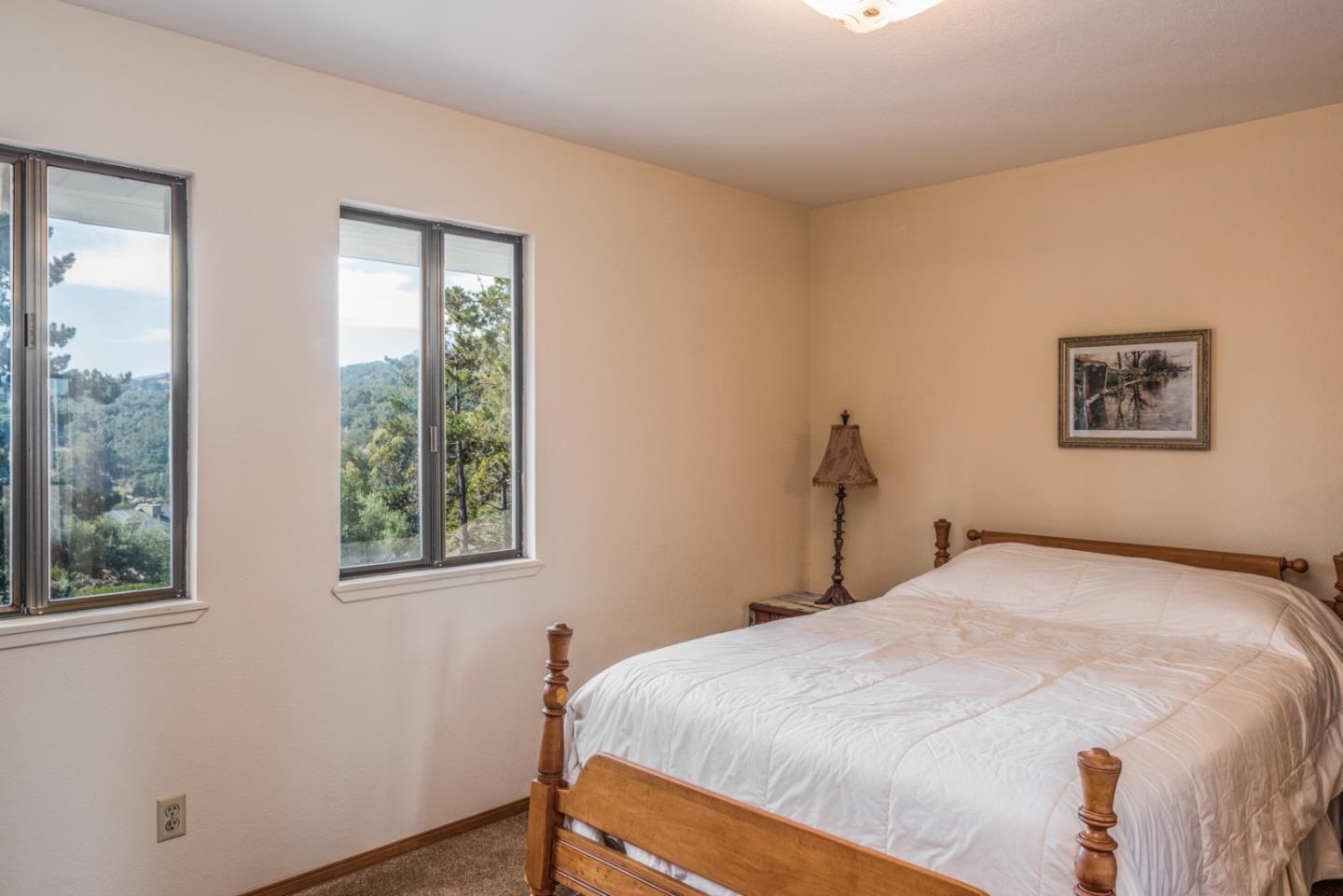 12765 Sundance Lane Carmel Valley, CA 93924 - Photo 21 of 43 a bedroom with a bed and a window