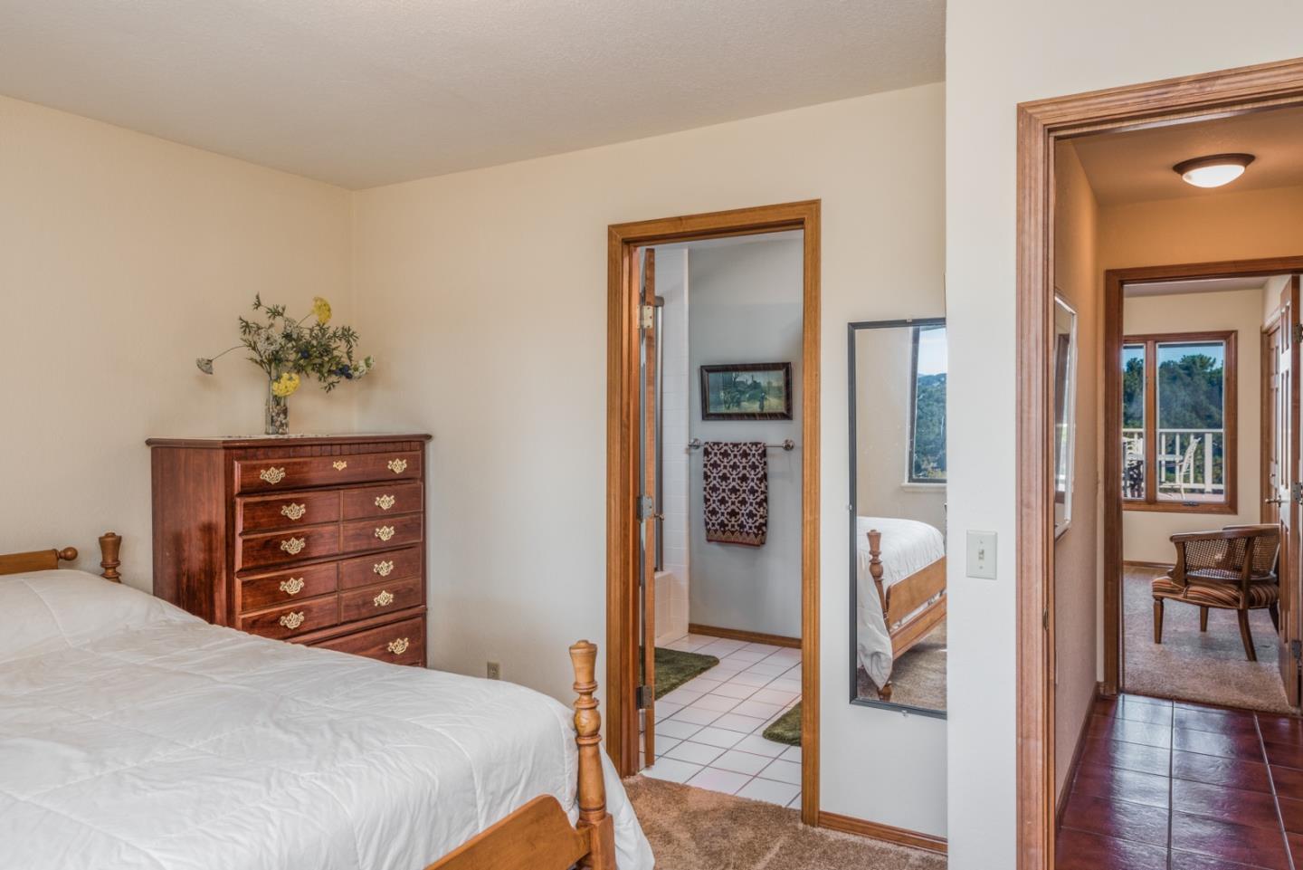 12765 Sundance Lane Carmel Valley, CA 93924 - Photo 22 of 43 a bedroom with a bed and a dresser