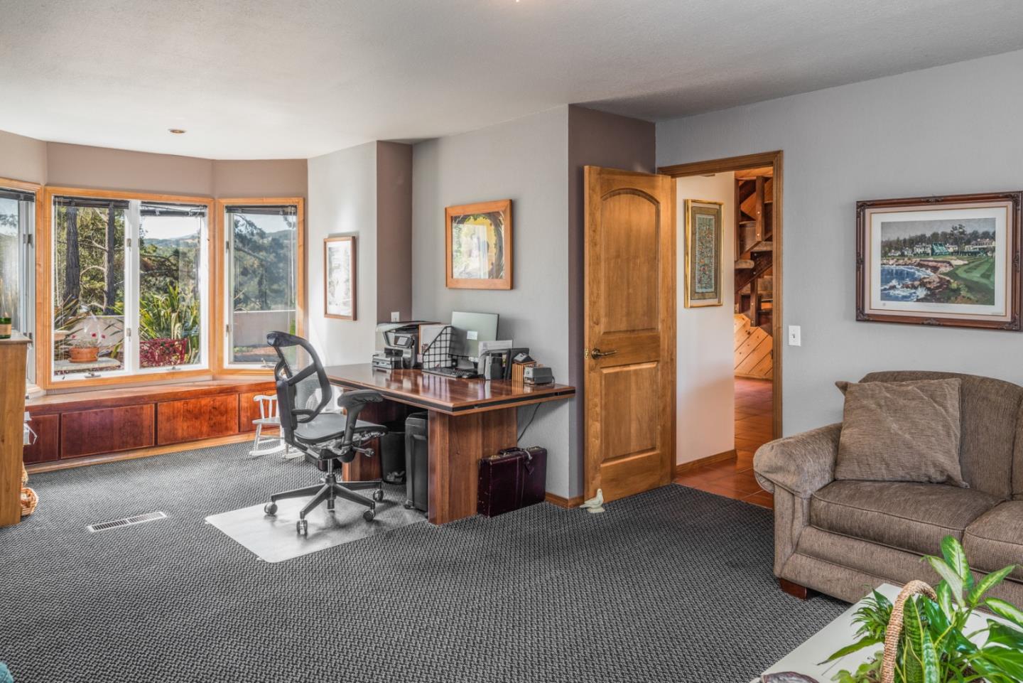 12765 Sundance Lane Carmel Valley, CA 93924 - Photo 25 of 43 a living room with furniture a table and a large window