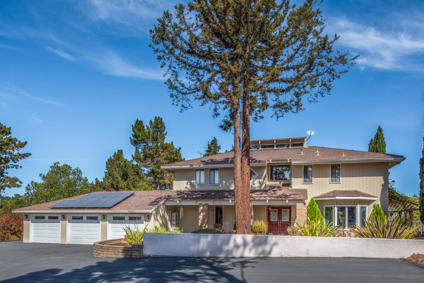 12765 Sundance Lane Carmel Valley, CA 93924 - Photo 3 of 43 a front view of a residential apartment building with a yard