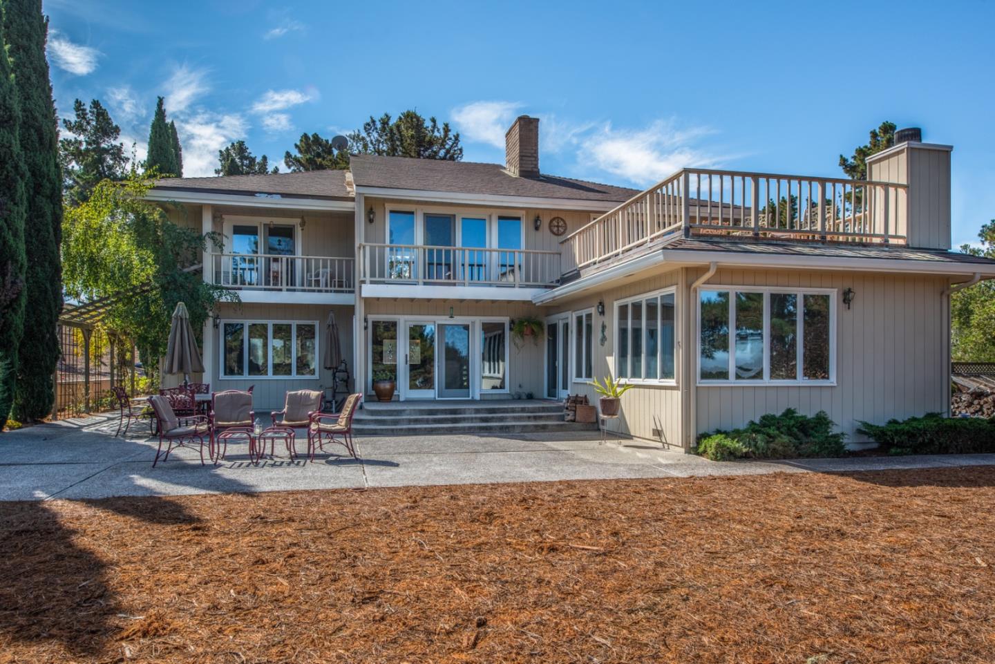 12765 Sundance Lane Carmel Valley, CA 93924 - Photo 31 of 43 a front view of a building with lots of water fountain and furniture
