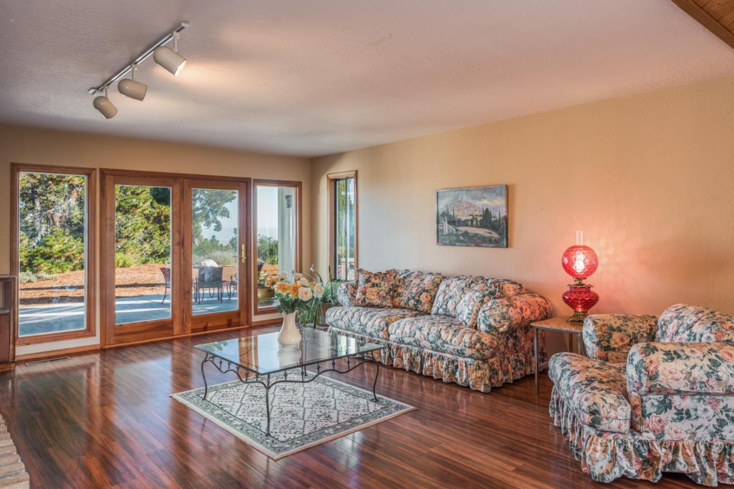 12765 Sundance Lane Carmel Valley, CA 93924 - Photo 6 of 43 a living room with furniture and a floor to ceiling window