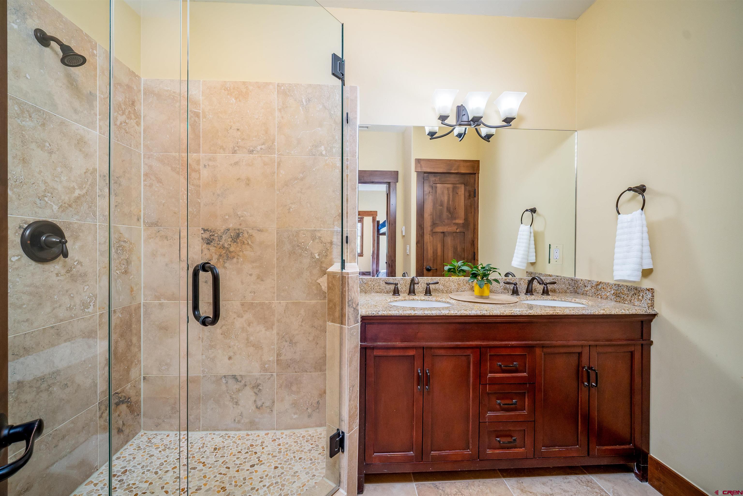 259 Engineer Drive Durango, CO 81301 - Photo 16 of 40 a bathroom with a sink and a mirror