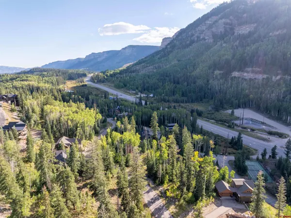a bedroom with a bed and a view of wooden floor
