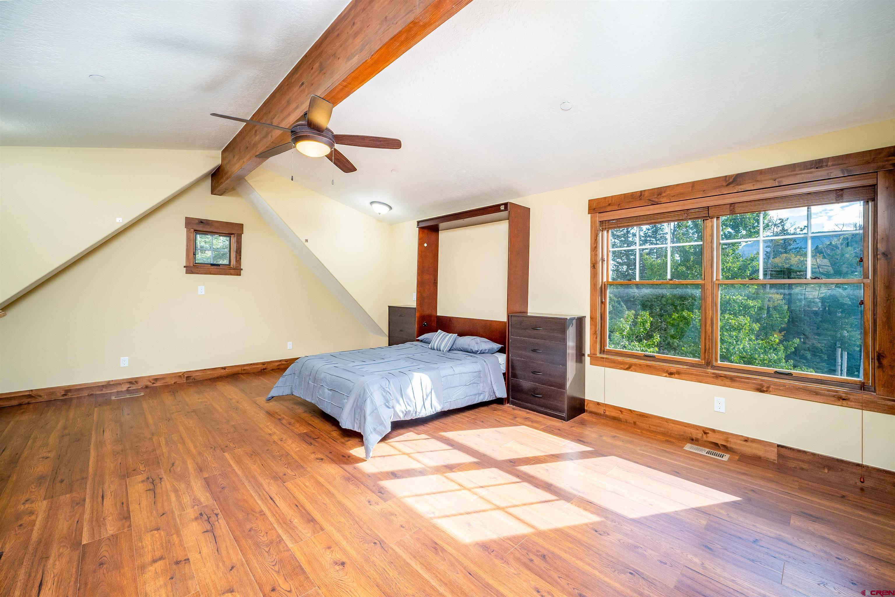 259 Engineer Drive Durango, CO 81301 - Photo 19 of 40 a living room with a floor to ceiling window and wooden floor