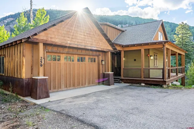 a view of a house with wooden fence