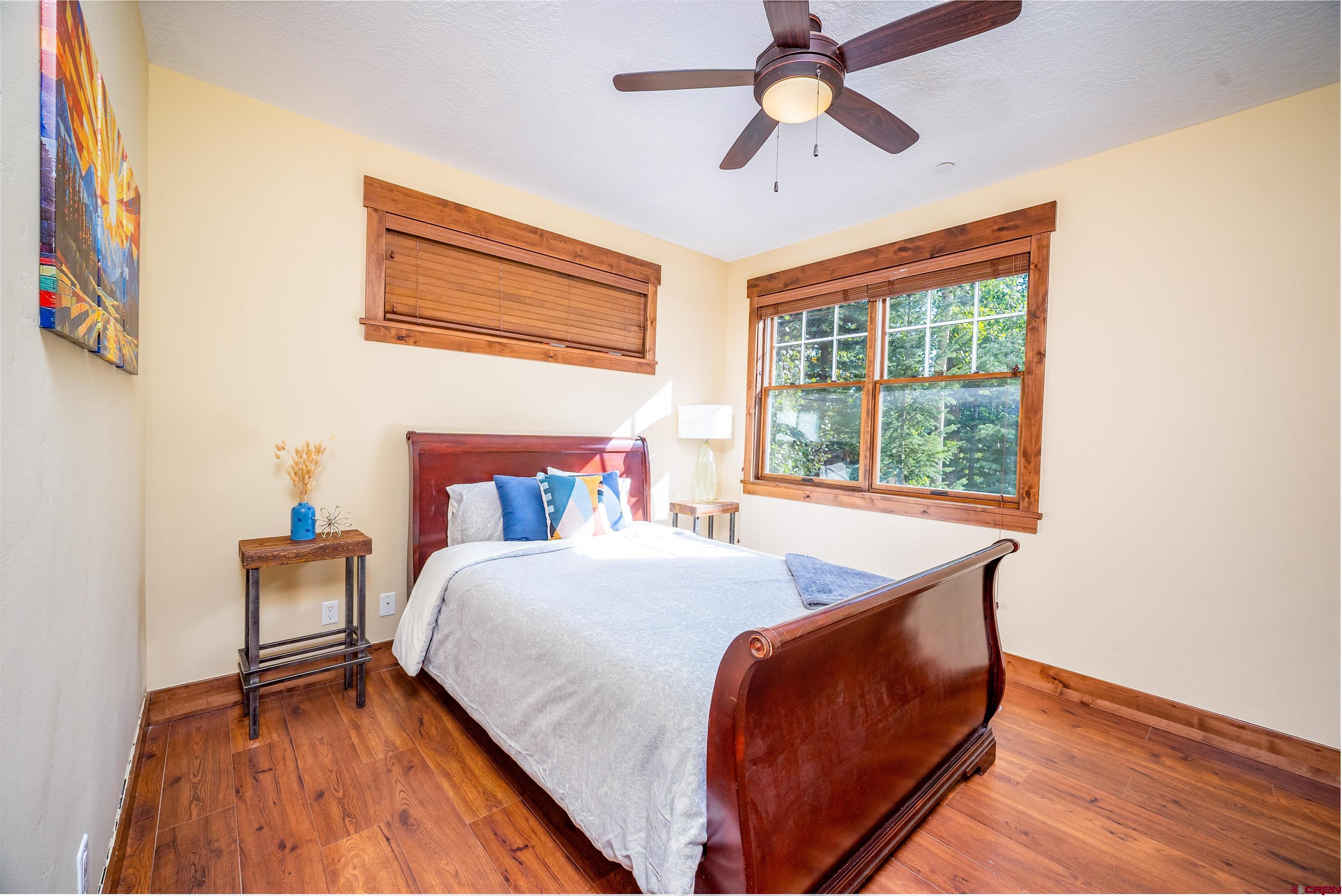 259 Engineer Drive Durango, CO 81301 - Photo 7 of 40 a bed sitting in a bedroom next to a window