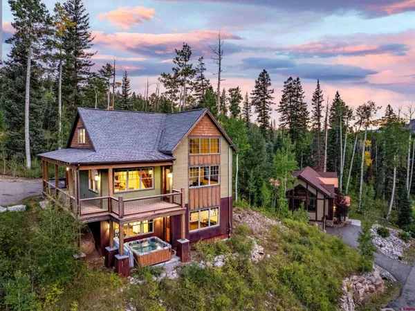 a aerial view of a house with a yard