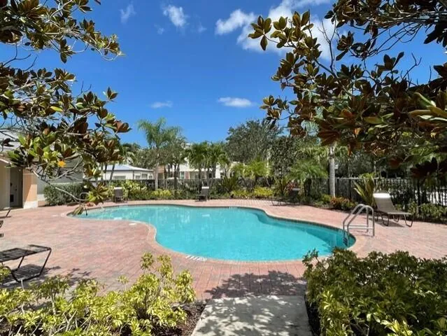 a view of a swimming pool with a patio
