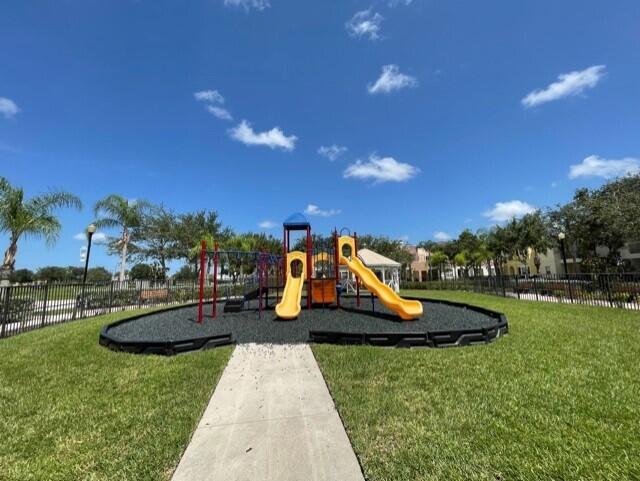 10560 Southwest Stephanie Way, Unit 1206 Port St. Lucie, FL 34987 - Photo 12 of 23 a view of a park with slide