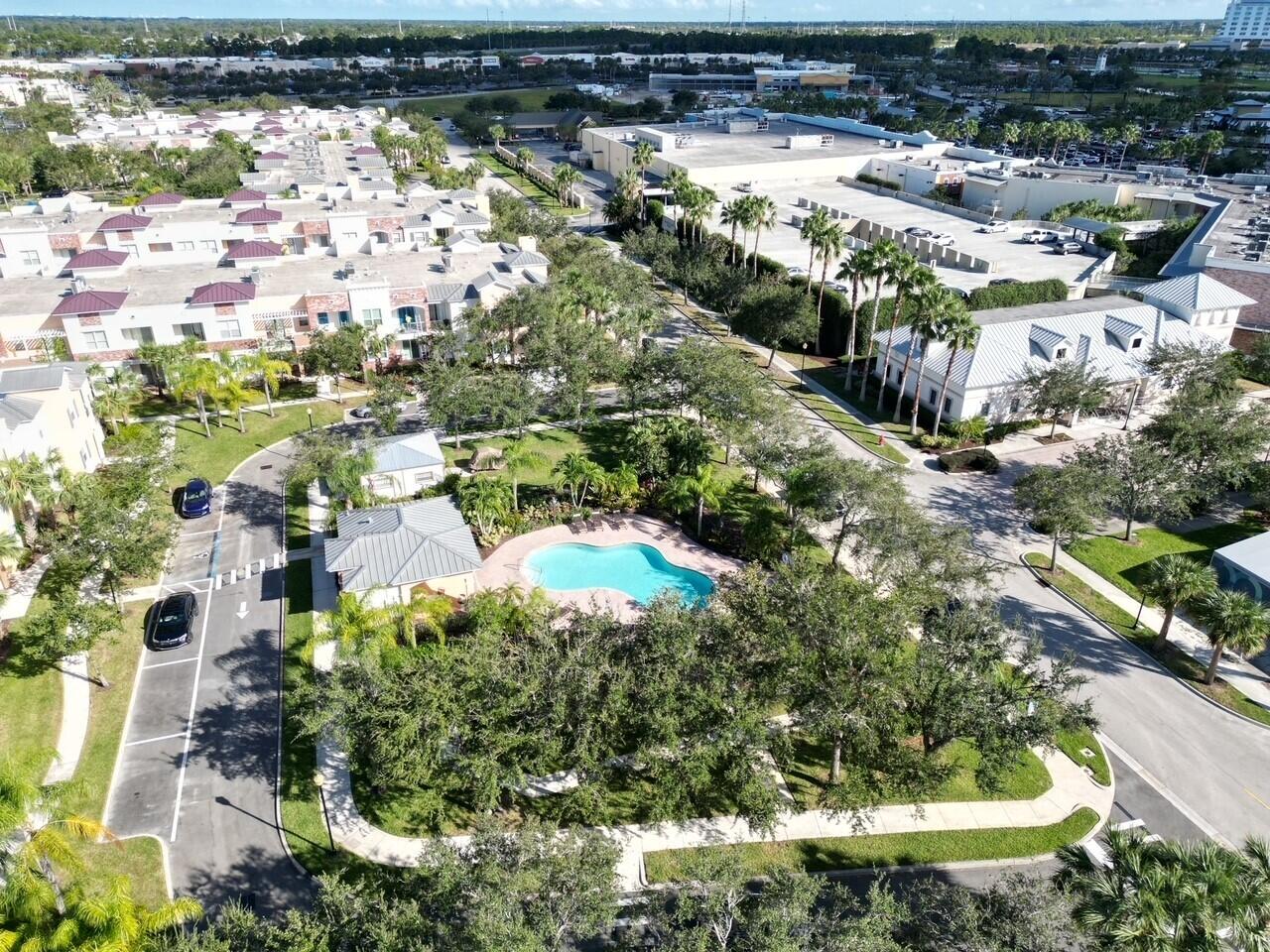 10560 Southwest Stephanie Way, Unit 1206 Port St. Lucie, FL 34987 - Photo 14 of 23 a view of a lake with a city