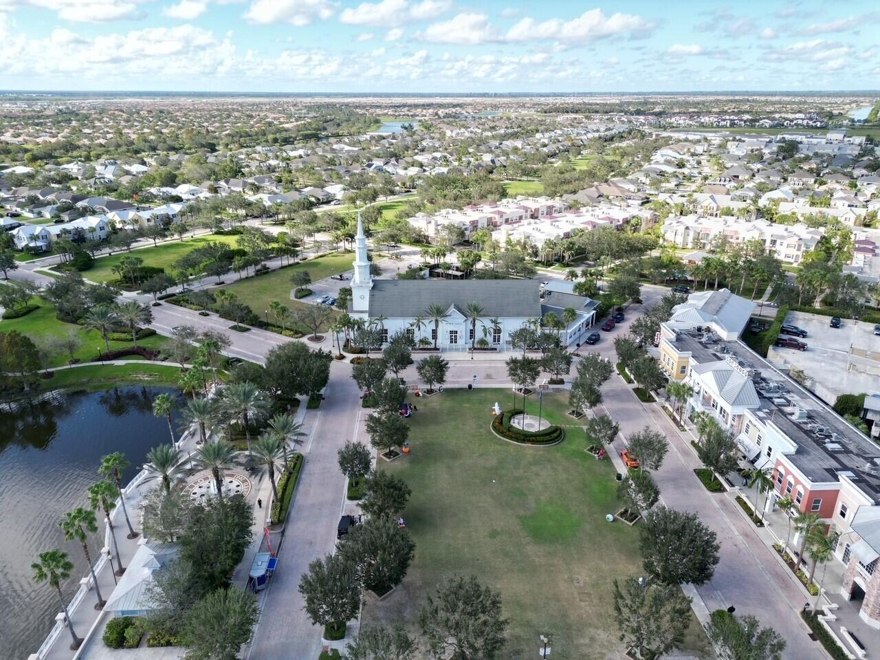 10560 Southwest Stephanie Way, Unit 1206 Port St. Lucie, FL 34987 - Photo 21 of 23 an aerial view of residential houses with outdoor space